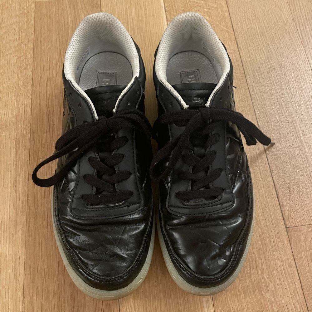 Black shiny Reebok sneakers